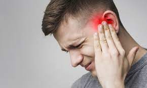 Image of a man suffering a headache as a result of teeth grinding