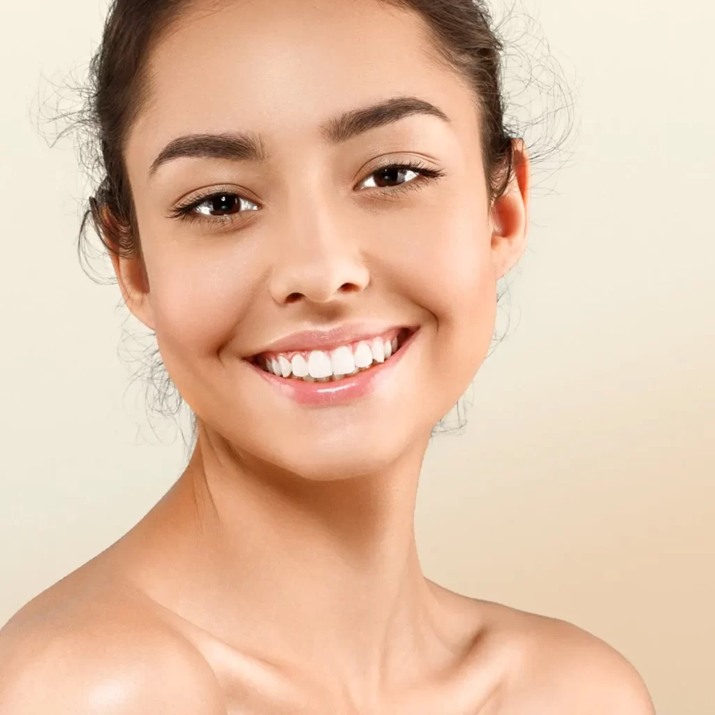 Woman with even skin tone smiling